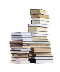 Stacks of many different books isolated on white
