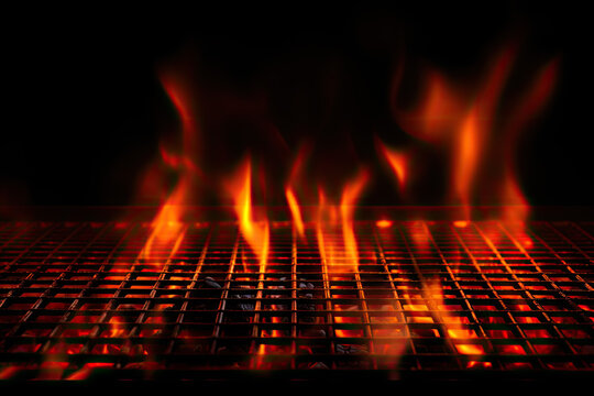 an image of some fire burning down in the dark on a grill