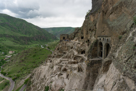 Day view of caves, stairs and mountains. Vardzia is a cave monastery, an ancient rock-hewn town, was excavated in the Erusheti Mountain.