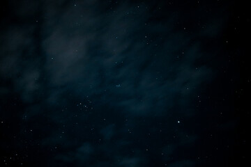 Night sky - Universe filled with stars. Stars in the night sky through the clouds