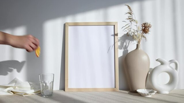 Video photo frame mockup with white vase and dry flowers