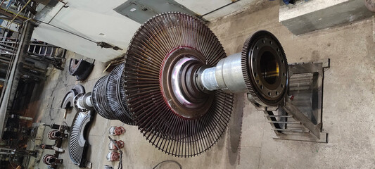 Disassembled steam turbine in the process of repairing and electric generator at power plant © alexrow
