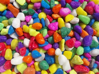 Beautiful multi-colored small rocks and pebbles. Colorful stones in different size and colors. Decorative item.