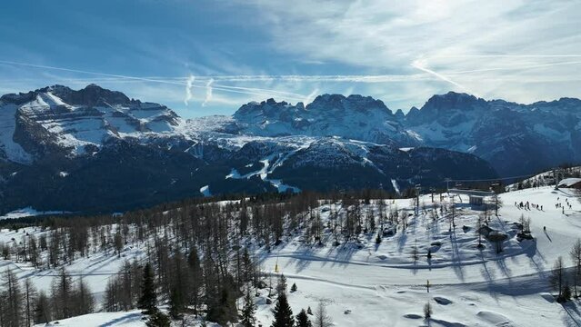 Aerial drone Winter dolomites in Italy. Winter in Madonna di Campiglio village and a ski resort in Italy. Madonna di Madonna di Campiglio and ursus snowpark in Val Rendena dolomites trentino Italy. 