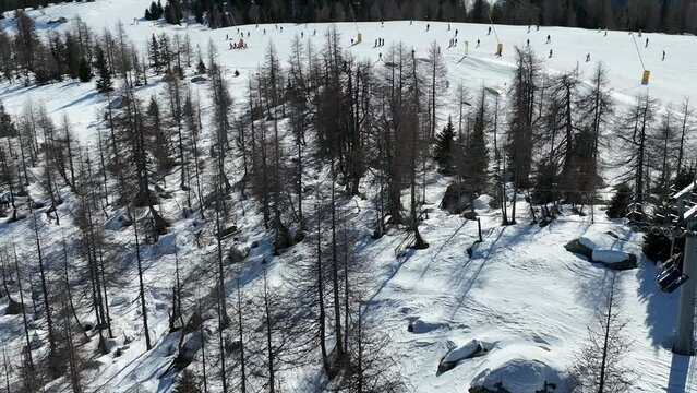 Aerial drone Winter dolomites in Italy. Winter in Madonna di Campiglio village and a ski resort in Italy. Madonna di Madonna di Campiglio and ursus snowpark in Val Rendena dolomites trentino Italy. 