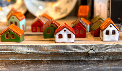 Multi-colored houses made of handmade clay, varnished