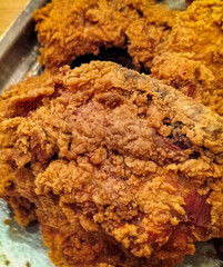 Side view. Crispy kentucky fried chicken is fried in a spiced flour which has been seasoned....