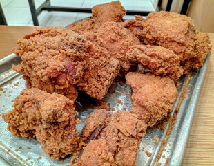 Side view. Crispy kentucky fried chicken is fried in a spiced flour which has been seasoned. Selective focus.
