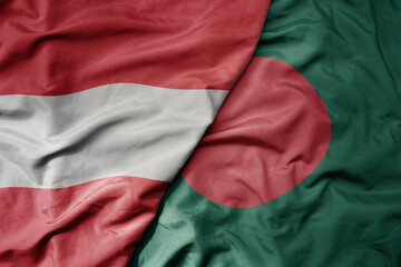 big waving national colorful flag of bangladesh and national flag of austria .