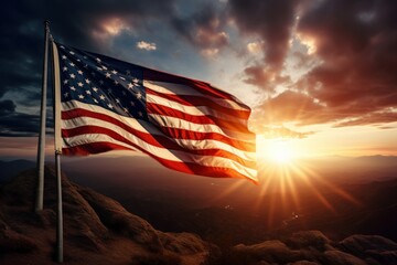 US flag in top of a hill against sun rays