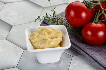 Dijon mustard sauce in the bowl