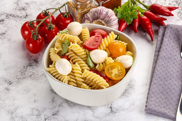 Italian pasta with mozzarella and tomato