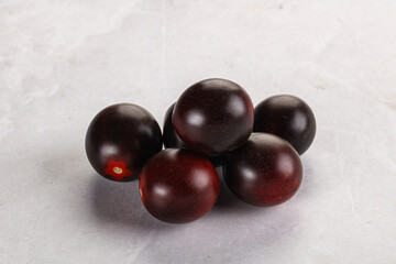 Raw ripe black kumato tomato