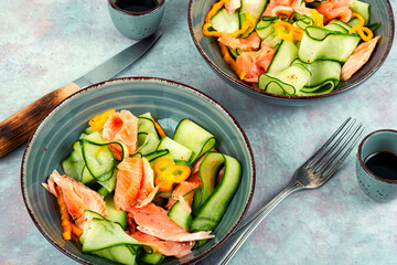 Fresh fish salad with raw cucumber.
