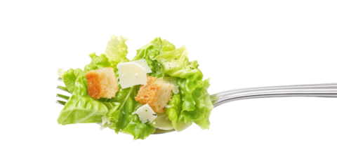 forkful of Caesar salad with crisp romaine lettuce, croutons and parmesan shavings.