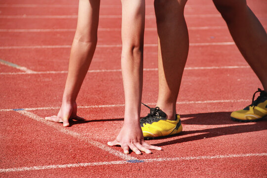 Cropped image of a sprinter getting ready to start at the stadium