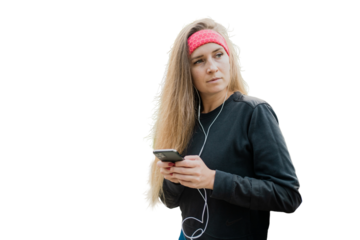 A fitness woman uses an application with music for sports, listens to tracks with headphones. Transparent isolated background.