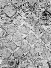 evocative black and white texture image of ancient wall bricks