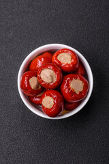 Red bell peppers stuffed with cheese or meat with salt, spices and herbs