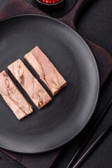 Delicious canned dietary tuna meat with salt, spices and oil