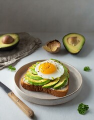 fried egg and avocado slices with toast
