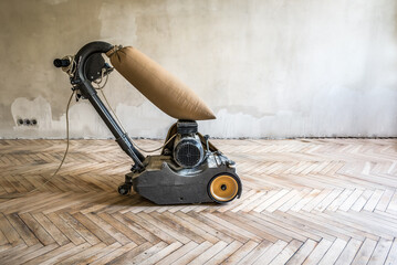 Professional grinding sanding machine for parquet floor. Industrial theme