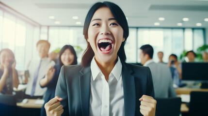 Portrait of happy young asian woman in the office