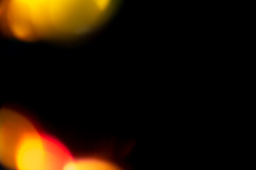 Multicolored highlights on a black background. for overlay to create a festive, vibrant effect