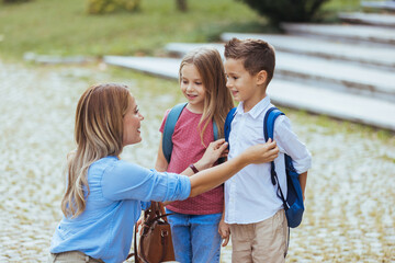 Mother, daughter and son preparing the first day going study back to school student concept at...