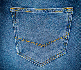 Blue jeans pocket. Jeans texture. Copy space. Selective focus.