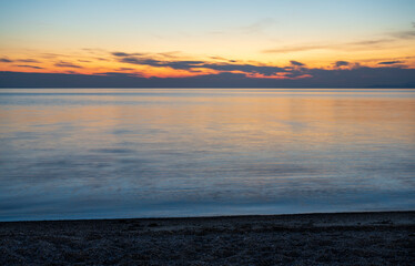 Tranquil scene of beautiful sea at sunset. Orange and yellow sunset on the sea. Aerial panoramic...
