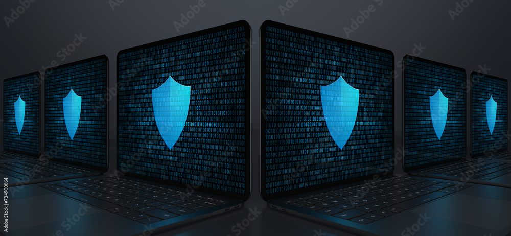 Poster laptop devices forming an angle with a digital shield icon on their screens on a dark background. re