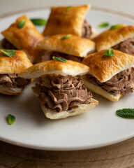 Miguelitos de la roda de chocolate. Spanish Desserts made with puff pastry and chocolate cream.