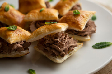 Miguelitos de la roda de chocolate. Spanish Desserts made with puff pastry and chocolate cream.