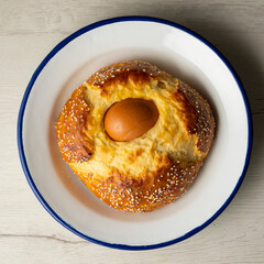 Mona de Pascua, sponge cake with boiled egg. Traditional Spanish dessert for Holy Week