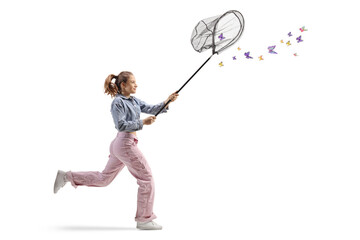 Teenage girl running and catching butterflies with a net