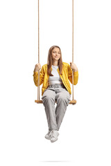 Female teenager sitting on a swing