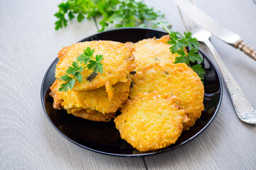fried vegetarian potato pancakes in a plate.