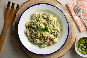 Gnocchi with yogurt sauce and asparagus. Italian potato gnocchi with traditional sauce.