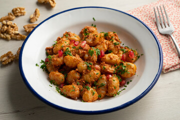 Gnocchi with pesto rosso sauce. Italian potato gnocchi with traditional sauce.