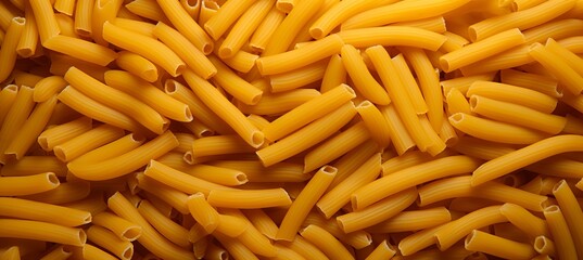 Top view of delicious traditional italian pennettine pasta forming a captivating abstract background