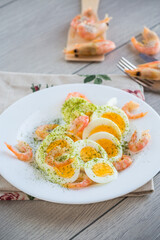 boiled eggs with boiled shrimp in a plate for breakfast