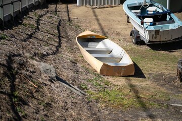 in a yard tinny dinghy boat On the beach in summer in Australia