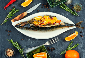 Whole mackerel baked with oranges.