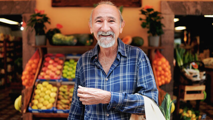 Asian senior man shopping at farm market. Customer buying at grocery store. Small business concept