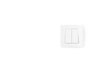 White light switch on white wall. Electrician background.