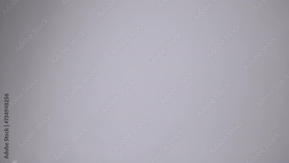 Poster group white soap bubbles moving on a gray background in empty space. close up. blowing large, small 