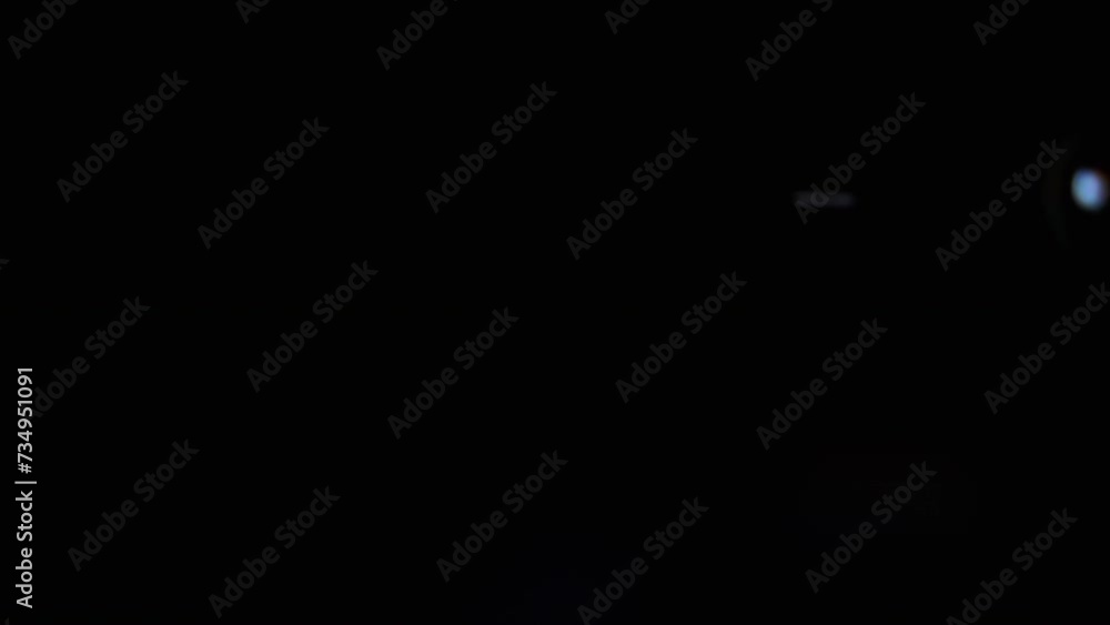Poster flying and falling transparent soap bubbles in dark on a black background. a lot of colored soap bub