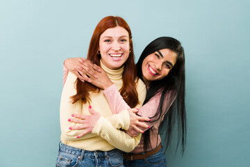 Happy young women hugging with a beautiful friendship
