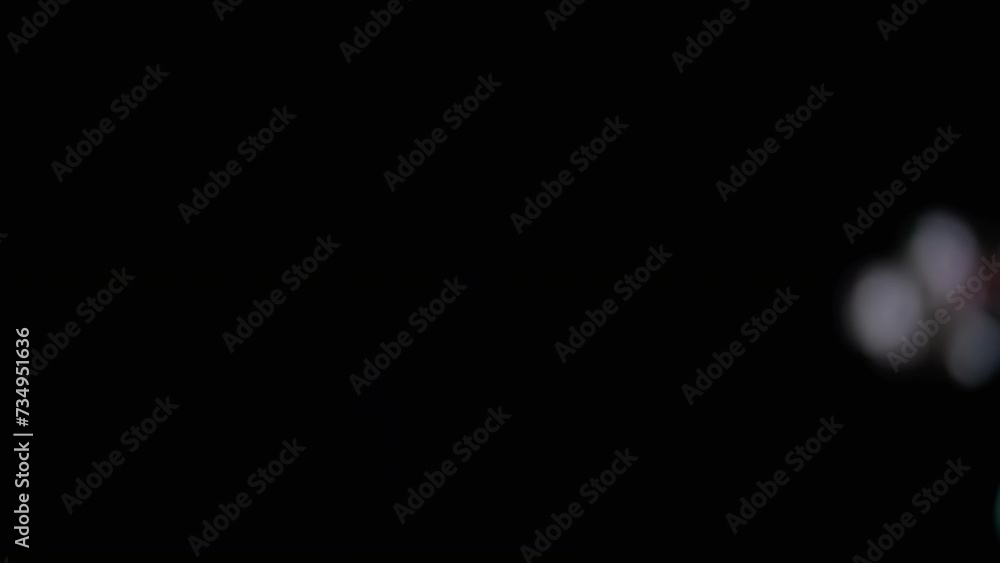 Poster lot of large colorful soap bubbles fly on a black background and burst. blowing. splash, foam. fast 